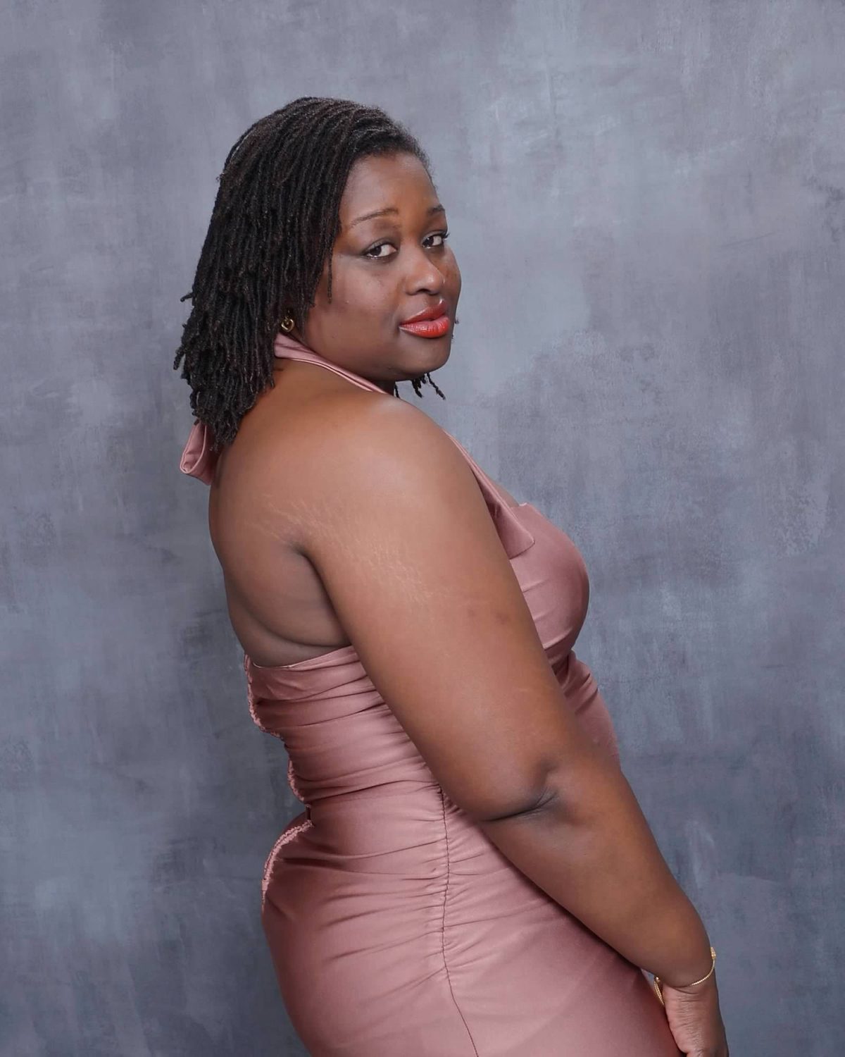 Rovna-Lyn T. Joseph in a blush satin dress